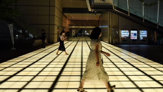 Women walking in Tokyo’s business district. About one in five women in the city live alone. Photograph: Noriko Hayashi/New York Times