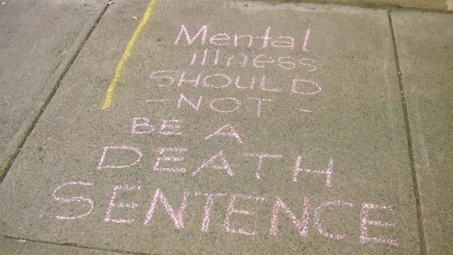 A message written in chalk outside of the Open Door Mission at 210 W. Main St.