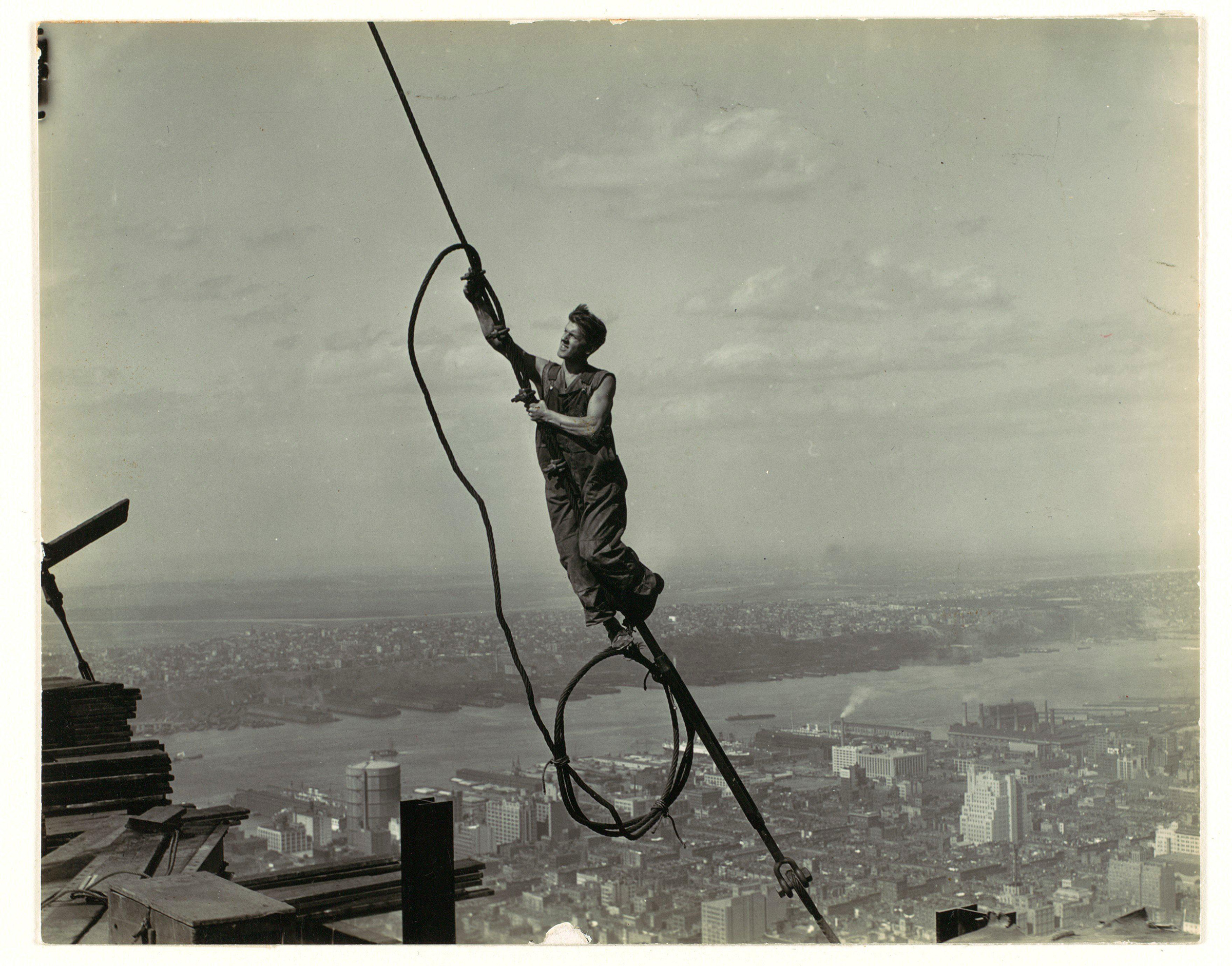 High up on the Empire State Building, 1930